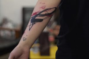 Lina Tattoo Forearm Black Red Strokes