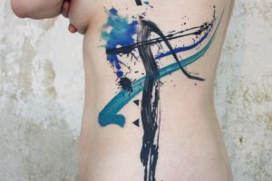 Lina Tattoo Ribs Blue Green Black Strokes Splashes